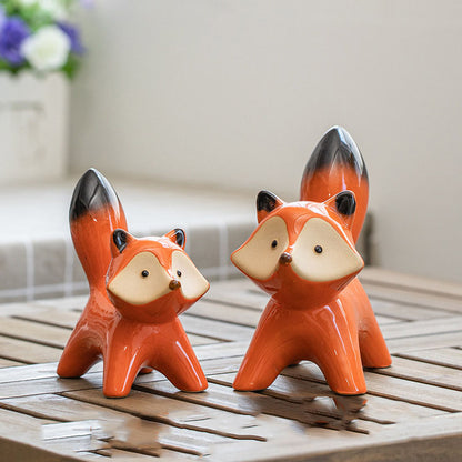 Set di 2 piccole simpatiche volpi in ceramica