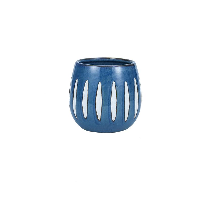 Vaso in ceramica blu con strisce bianche