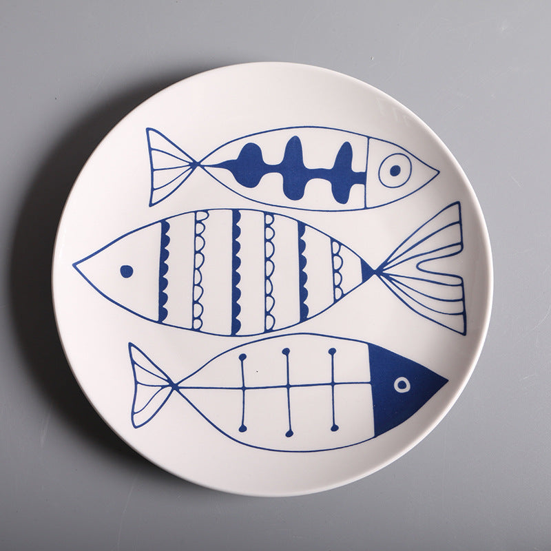 Piatto in ceramica con pesci blu