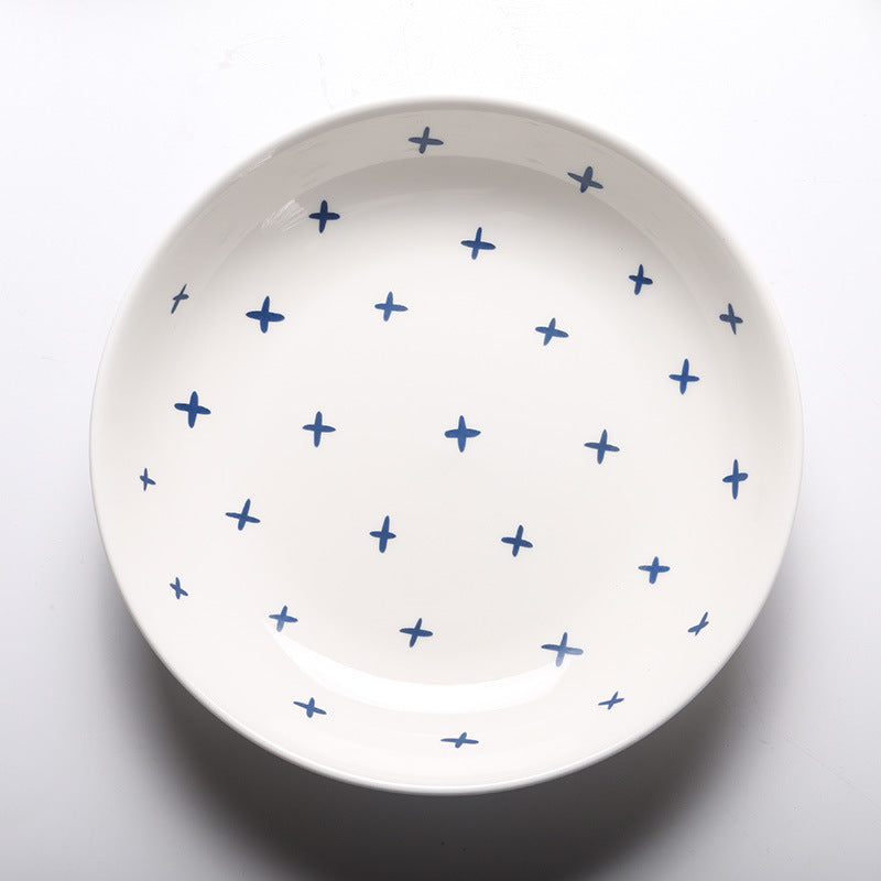 Piatti in ceramica con linee e stelline blu con design elegante