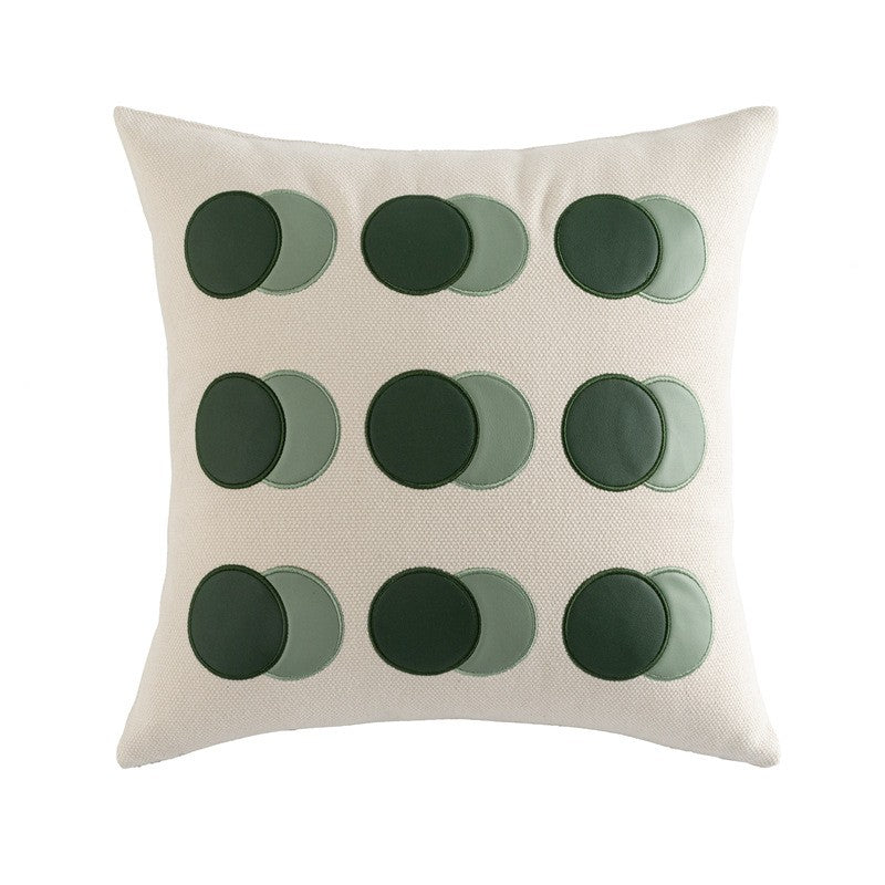 Cuscini e fodere in pelle con forme geometriche di colore verde