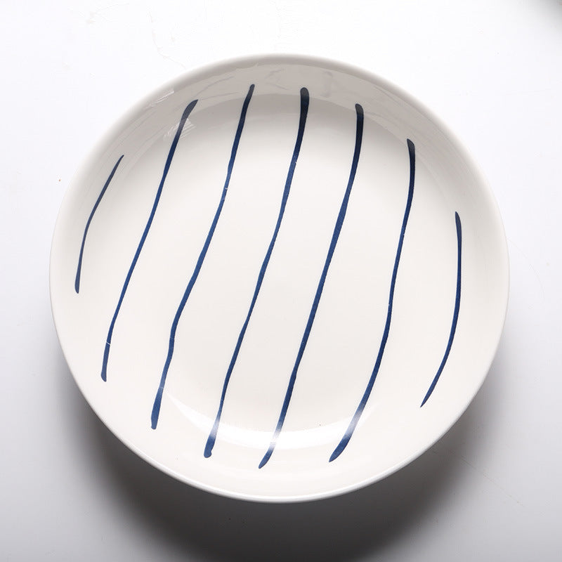 Piatti in ceramica con linee e stelline blu con design elegante