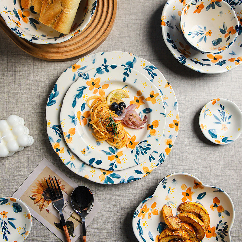 Piatti e ciotole in ceramica con fiori arancioni e foglie blu – AllaRicerca  Shop