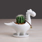 Vaso in ceramica a forma di dinosauro con piattino
