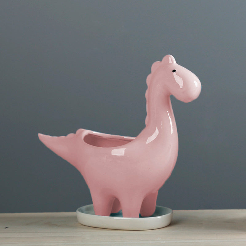 Vaso in ceramica a forma di dinosauro con piattino