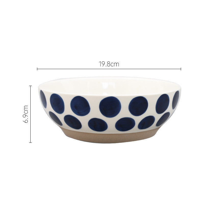 Ciotola in ceramica con linee e cerchi blu
