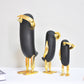 Pinguini con elementi dorati stile nordico