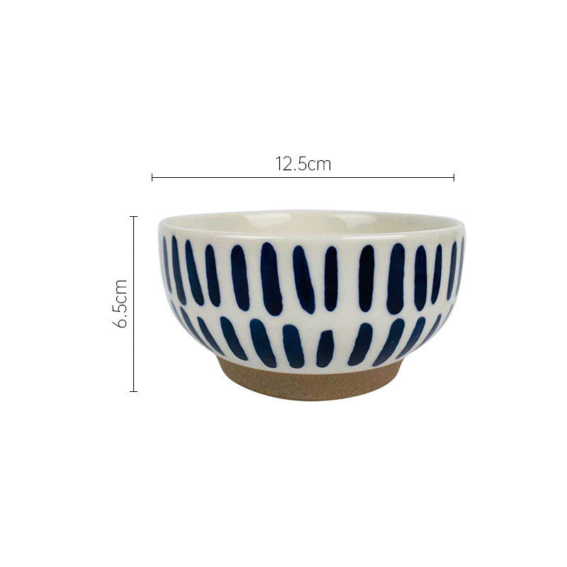 Ciotola in ceramica con linee e cerchi blu