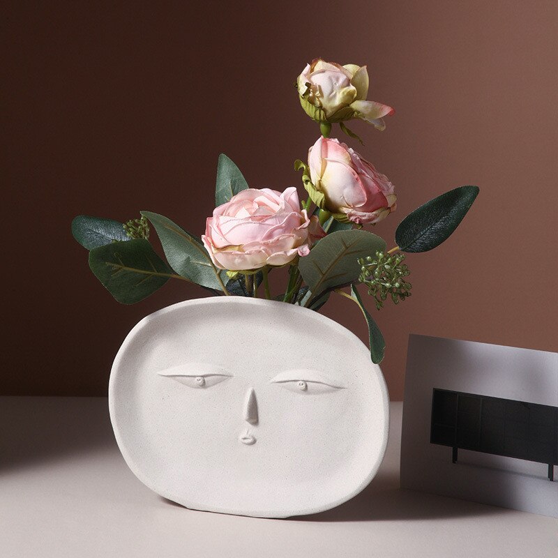 Vaso con espressioni faciali per fiori freschi o artificiali
