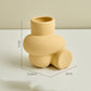 Vaso in ceramica a forma di nodo color pastello