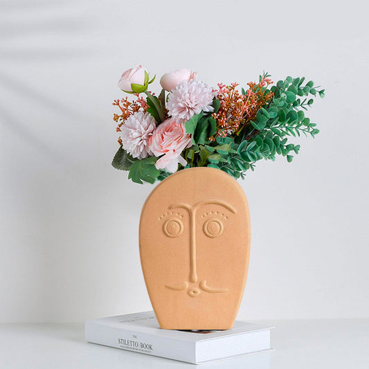 Vaso in ceramica con espressione facciale particolare