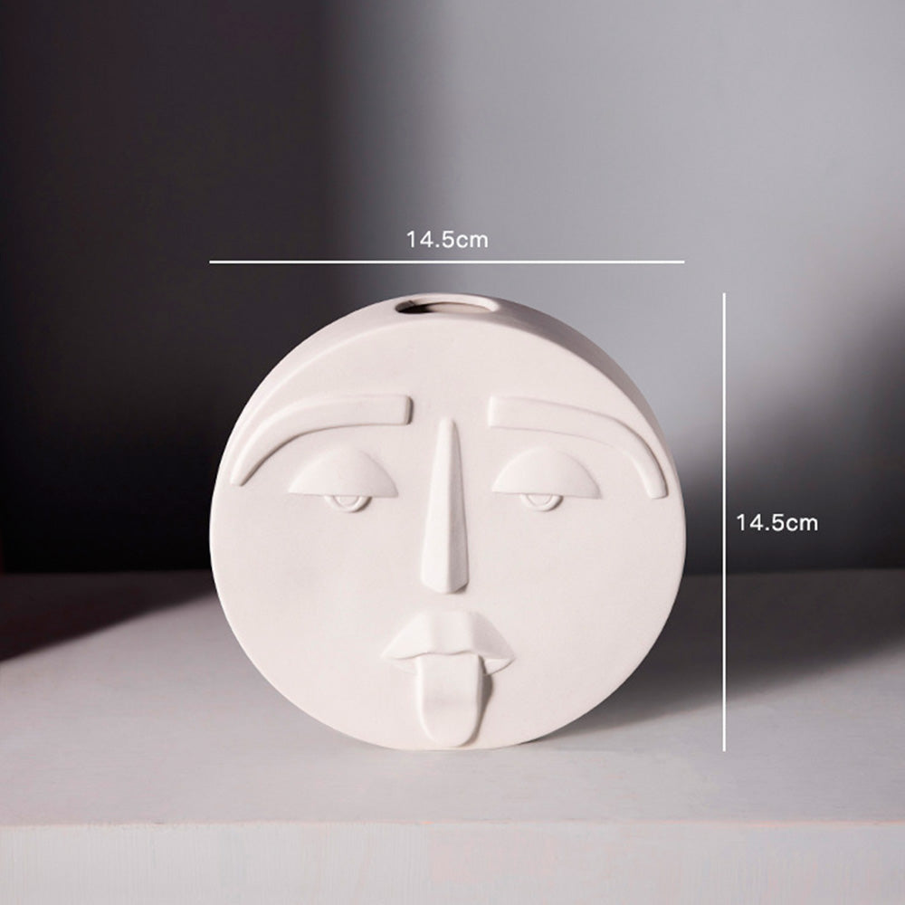 Vaso in ceramica con espressioni facciali